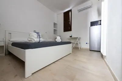 Letto o letti in una camera di Rosa Barocca