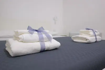 Letto o letti in una camera di Rosa Barocca