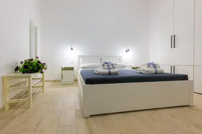 Letto o letti in una camera di Rosa Barocca