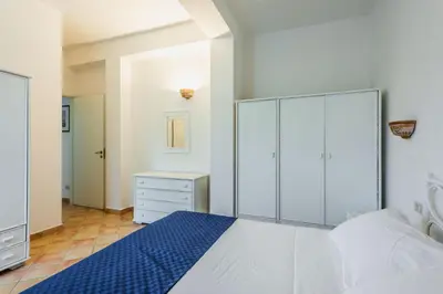 Letto o letti in una camera di Villa Arenella con Piscina by Wonderful Italy