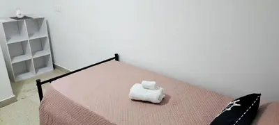 Letto o letti in una camera di Perla marina