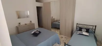 Letto o letti in una camera di Perla marina