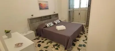 Letto o letti in una camera di Perla marina