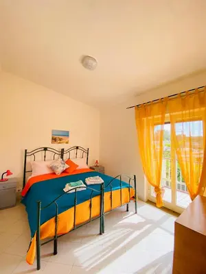 Letto o letti in una camera di Appartamento Fronte Mare Marzamemi