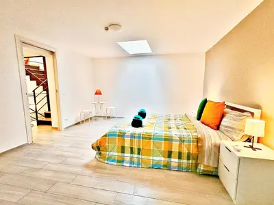 Letto o letti in una camera di Attico con terrazzo al centro storico di Catania