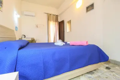 Letto o letti in una camera di CATANIA AIRPORT ROOM BAGNO PRIVATO iN CAMERA