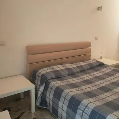 Letto o letti in una camera di CATANIA AIRPORT ROOM BAGNO PRIVATO iN CAMERA