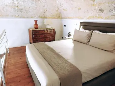 Letto o letti in una camera di Living Suite Catania Garibaldi