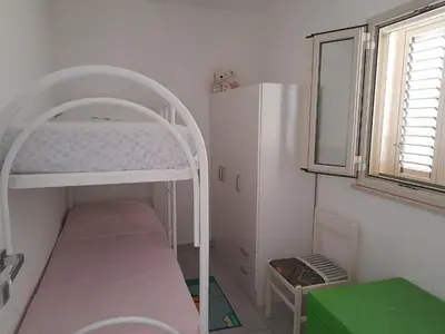 Letto o letti in una camera di villa Porto fossa