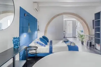 Area soggiorno di Judeka Suite Ortigia with Jacuzzi