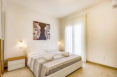 Letto o letti in una camera di Villa Andromeda by Villa Plus