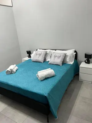 Letto o letti in una camera di casa vacanza I 4 diamanti room 2