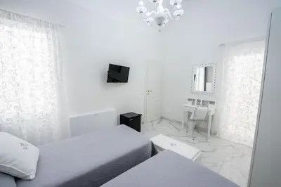 Letto o letti in una camera di SWEET HOME DELUXe