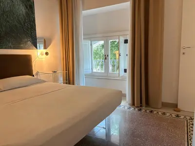 Letto o letti in una camera di CASA ARIEL Siracusa