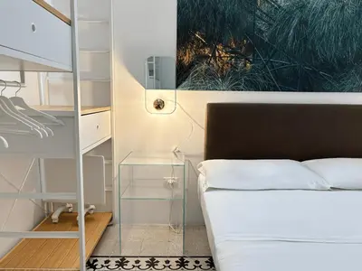 Letto o letti in una camera di CASA ARIEL Siracusa