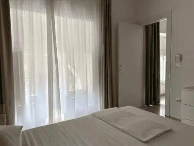 Letto o letti in una camera di CASA ARIEL Siracusa