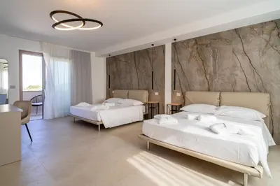 Letto o letti in una camera di Il Crepuscolo Marispica