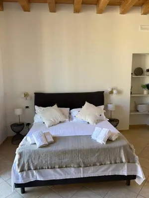 Letto o letti in una camera di Ciauru Apartment Ortigia
