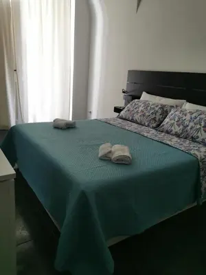 Letto o letti in una camera di Grimaldi Houses