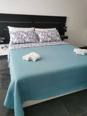 Letto o letti in una camera di Grimaldi Houses