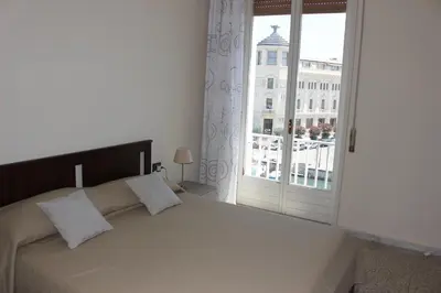 Letto o letti in una camera di appartamento Aretusa