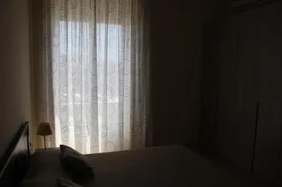 Letto o letti in una camera di appartamento Aretusa
