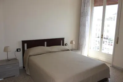 Letto o letti in una camera di appartamento Aretusa