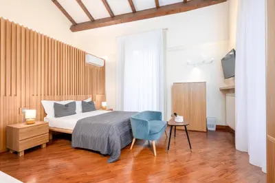 Letto o letti in una camera di Dimora Bellini