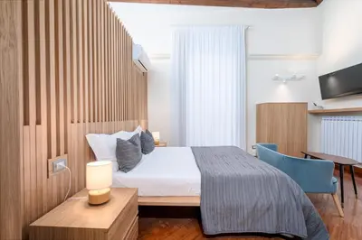 Letto o letti in una camera di Dimora Bellini