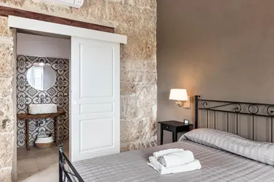 Letto o letti in una camera di Casale Micale