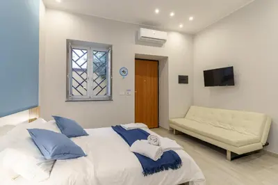 Letto o letti in una camera di Al Palazzetto - Colapesce