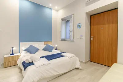 Letto o letti in una camera di Al Palazzetto - Colapesce