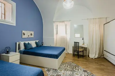 Letto o letti in una camera di SICILIAN MOOD - Garden House in the city ceter