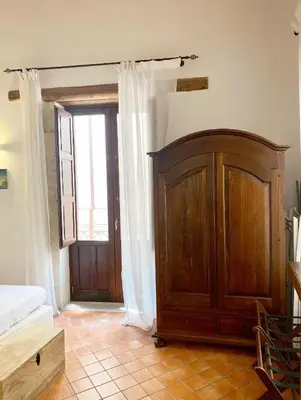 Letto o letti in una camera di La Casetta di Apollo