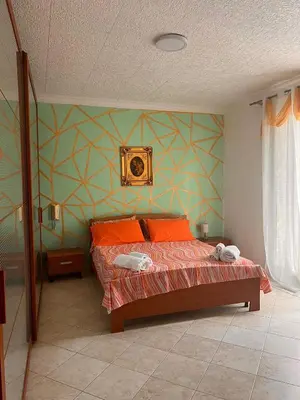 Letto o letti in una camera di Casa vacanze Alessandra