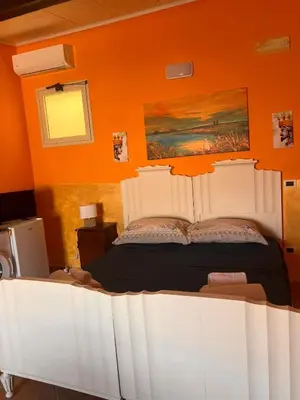 Letto o letti in una camera di Casa vacanze Alessandra