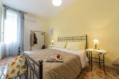 Letto o letti in una camera di Catania Inn Rooms