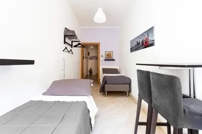 Letto o letti in una camera di Catania Inn Rooms
