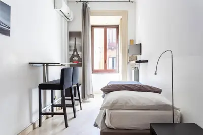 Letto o letti in una camera di Catania Inn Rooms