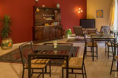 Area soggiorno di Catania Inn Rooms