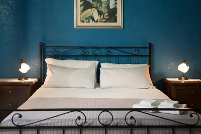 Letto o letti in una camera di Catania Inn Rooms