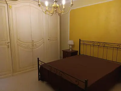 Letto o letti in una camera di Casa Adelaide