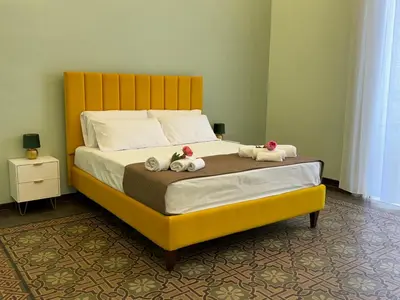 Letto o letti in una camera di Trewhella Home, Centro Storico, Duomo