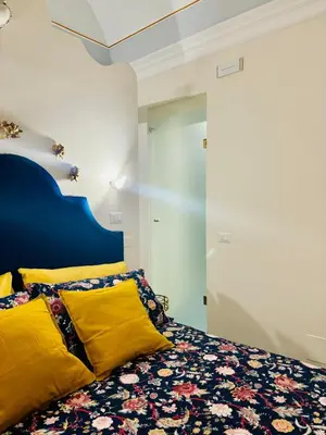 Letto o letti in una camera di Sangiuliano Suite