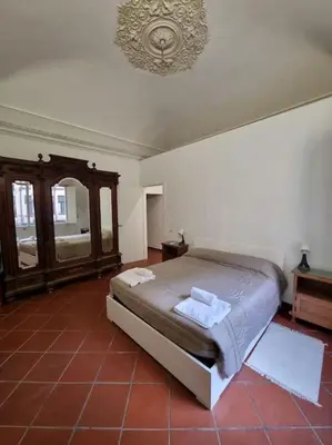 Letto o letti in una camera di palazzo mannino apartments