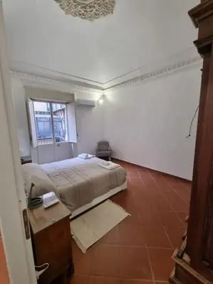Letto o letti in una camera di palazzo mannino apartments