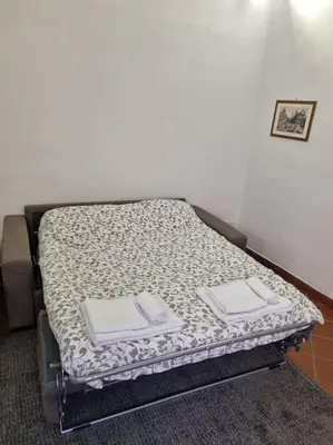 Letto o letti in una camera di palazzo mannino apartments