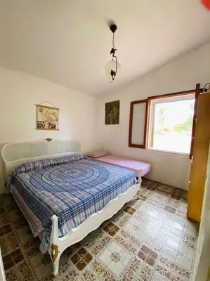 Letto o letti in una camera di Villa Lunè