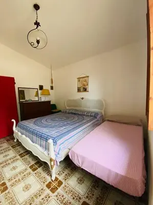 Letto o letti in una camera di Villa Lunè