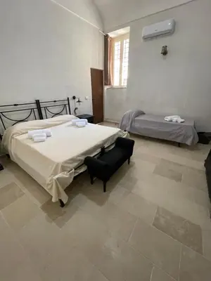 Letto o letti in una camera di Casa Michela